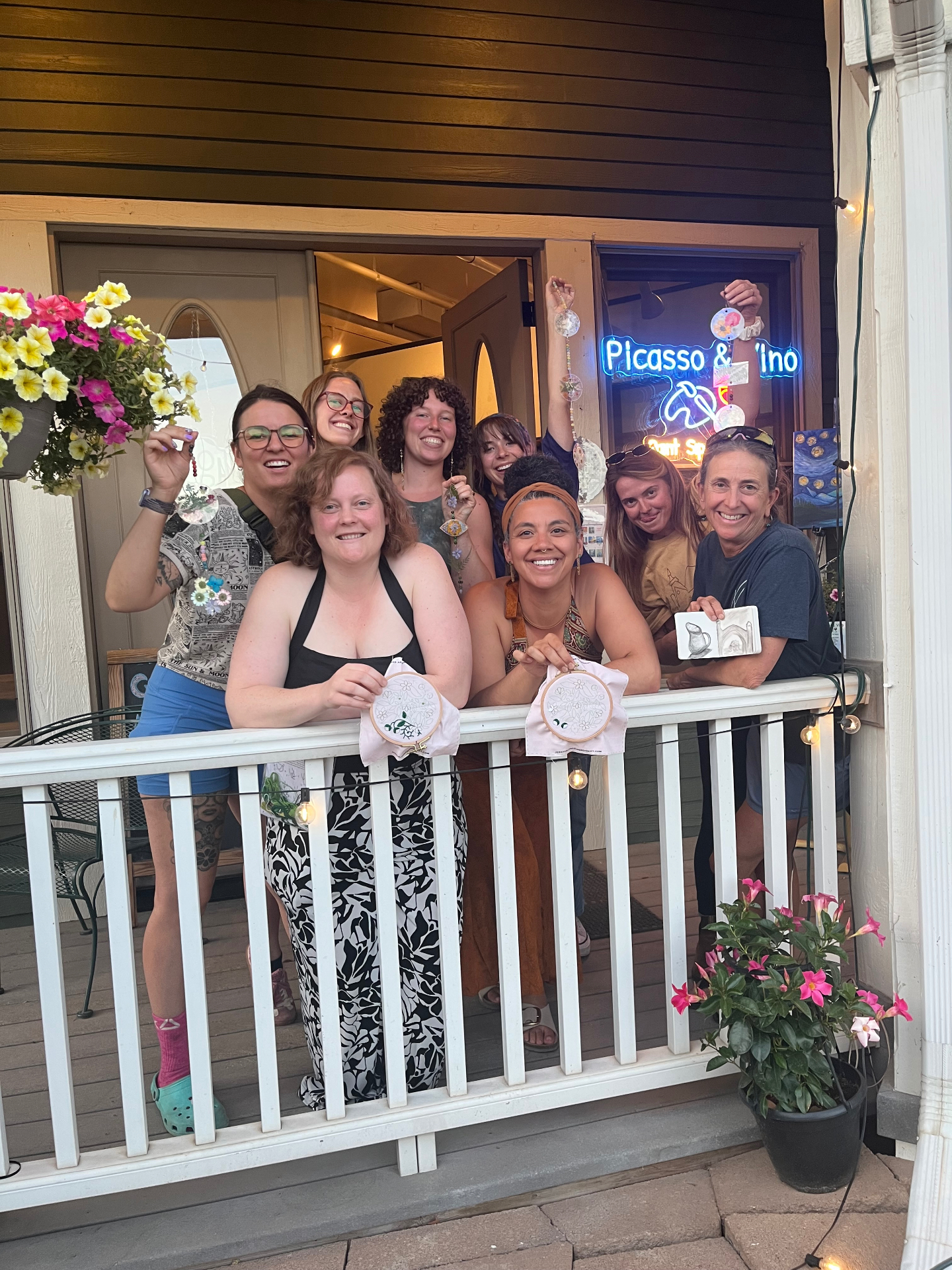 Happy group at Rabbitbrush Studio showing off their embroidery hoops and finished suncatchers